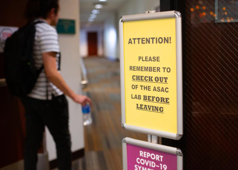 A sign posted outside a student tutoring center reminding students to check themselves out before leaving