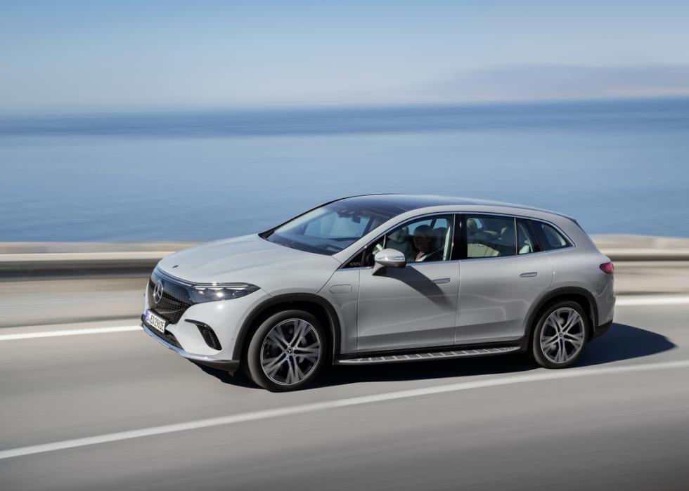 Mercedes-Benz EQS SUV on road next to ocean