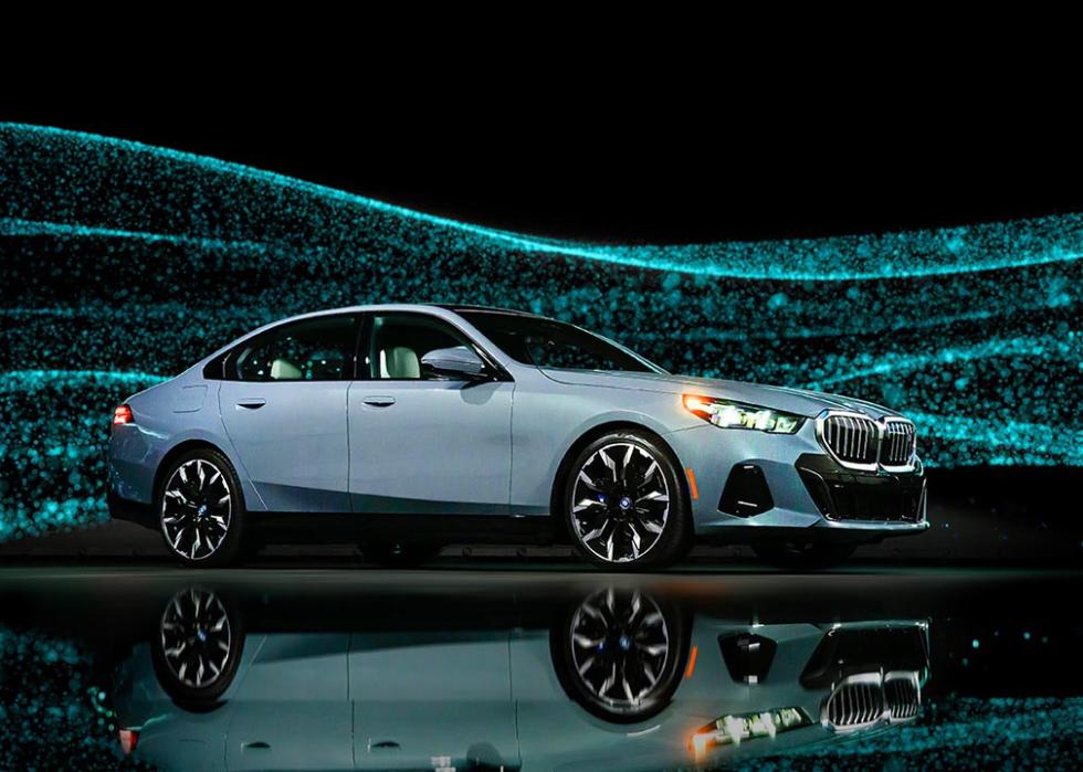 light blue BMWi5 against sparkly background