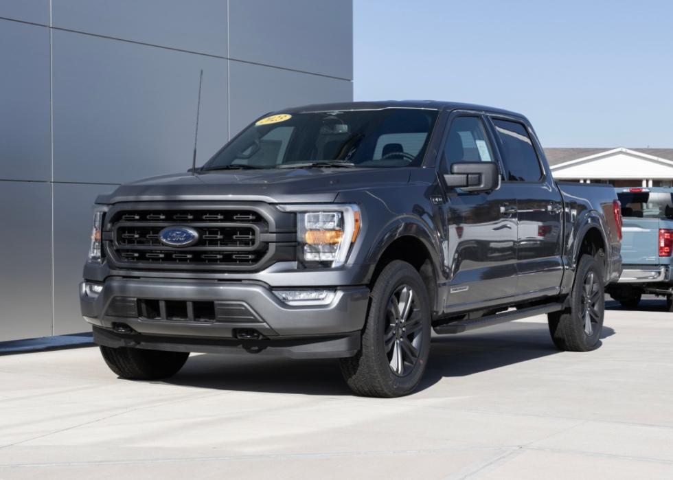 A Ford F-150 on display at a car dealership.