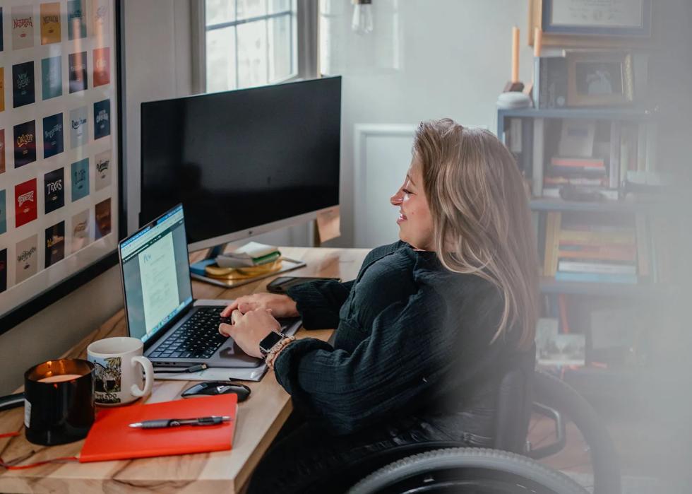 Emily Voorde works on the computer at home