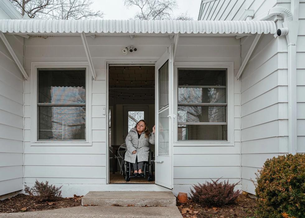 photo showing Voorde at the entrance to her home