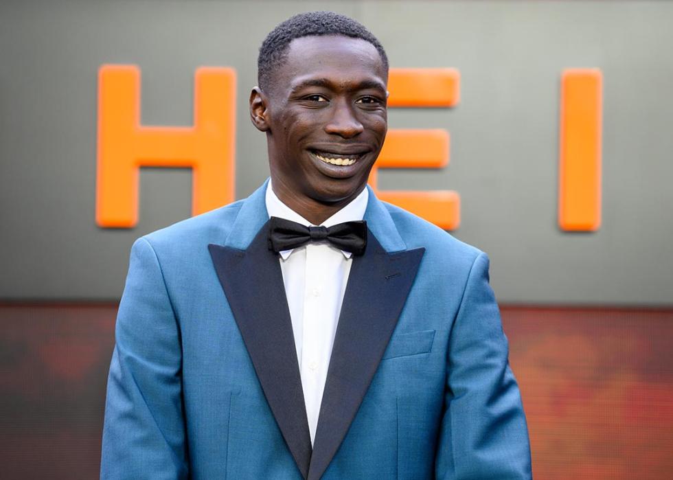 Khaby Lame attends the UK Oppenheimer movie opening wearing a blue suit.