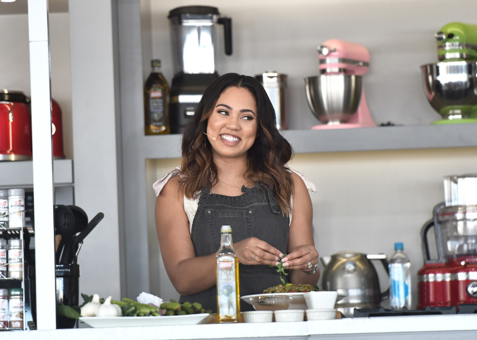 Ayesha Curry gives a cooking demo on stage at Goya Foods' Grand Tasting Village Featuring Mastercard Grand Tasting Tents & KitchenAid Culinary Demonstrations on February 25, 2017