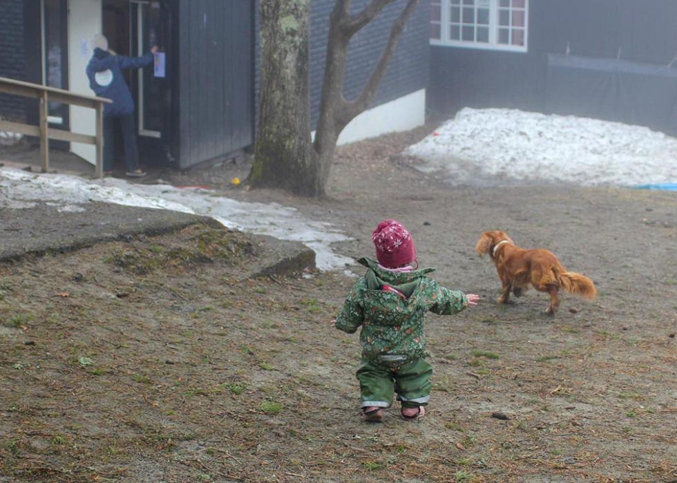 A toddler plays outside at the Turi Sletners child care program in north Oslo.