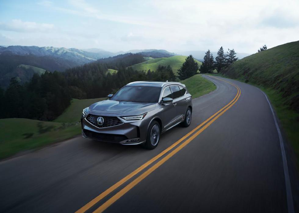 Photo of dark grey Acura MDX on the road.