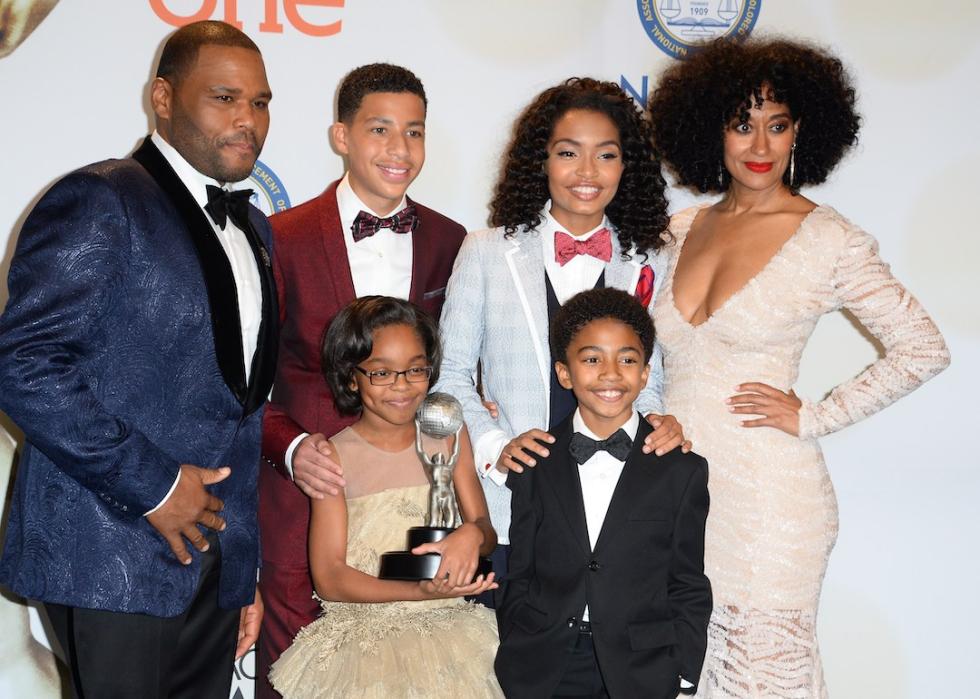 Actors Anthony Anderson, Yara Shahidi, Marcus Scribner, Tracee Ellis Ross, Marsai Martin, and Miles Brown pose with the award for Outstanding Television Comedy Series for "Black-ish" at the 2015 NAACP Image Awards in Pasadena, California.
