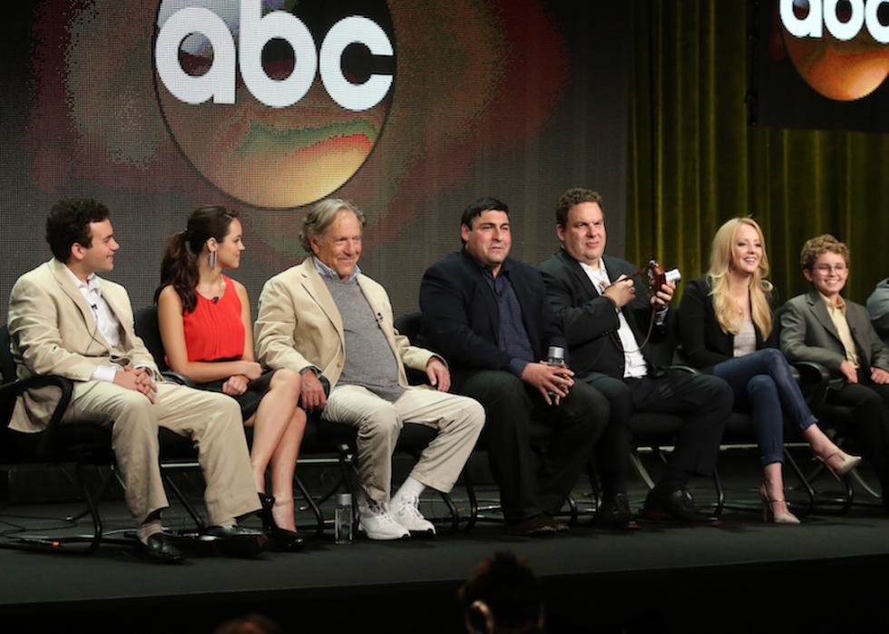 Actors Troy Gentile, Hayley Orrantia, and George Segal; writer/executive producer Adam F. Goldberg; actors Jeff Garlin, Wendi McLendon-Covey, and Sean Giambrone; executive producers Seth Gordon and Doug Robinson speak onstage during the "The Goldbergs" panel discussion at the 2013 Television Critics Association Summer Press Tour.