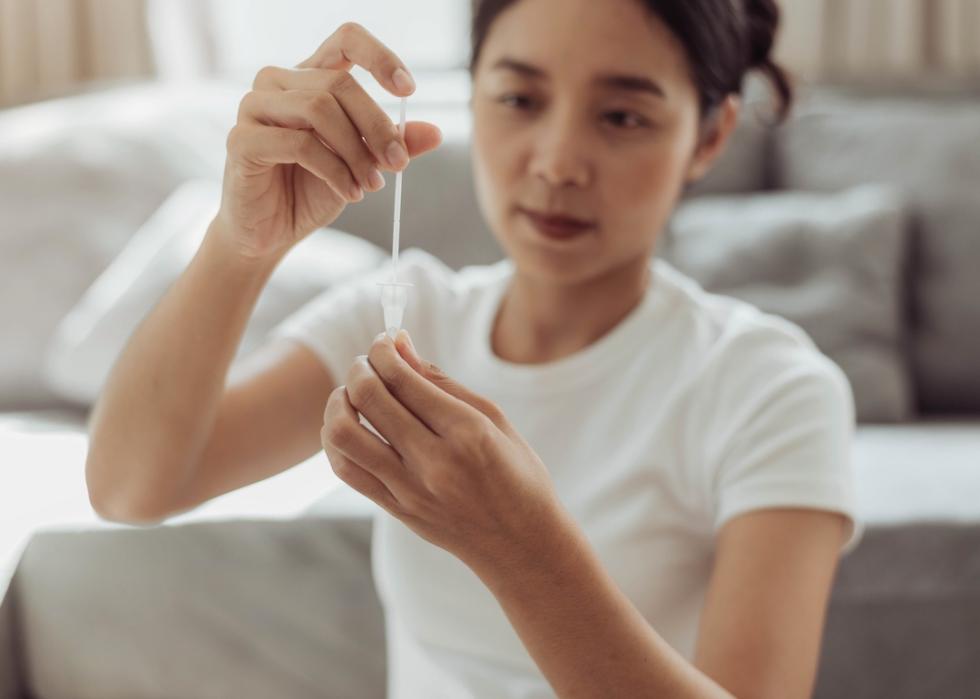 Person doing self test for COVID-19 at home.