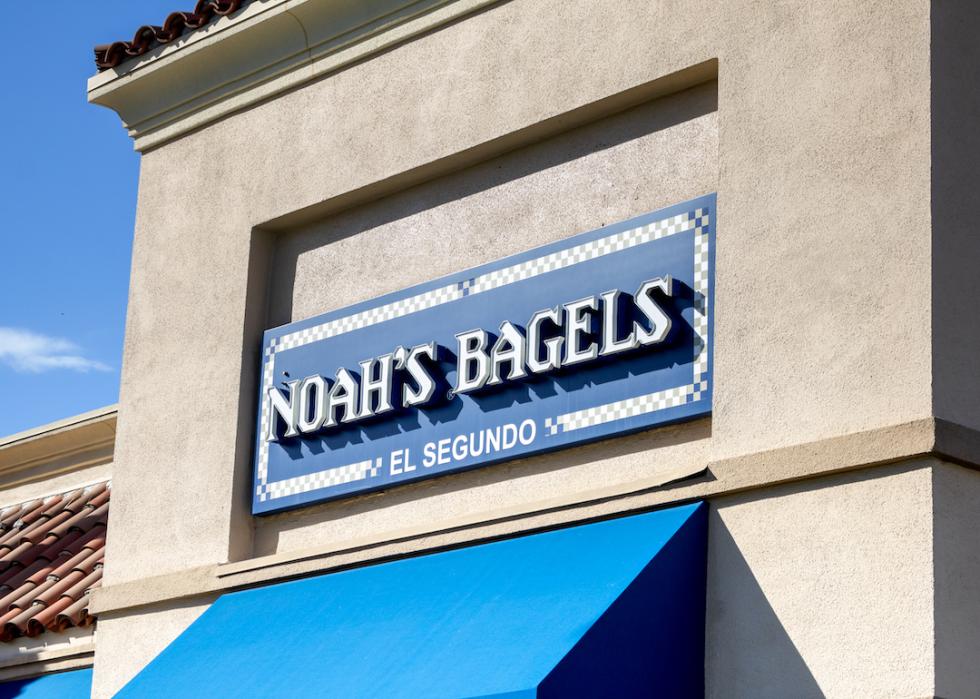 : A view of a store front sign for Noah's Bagels.
