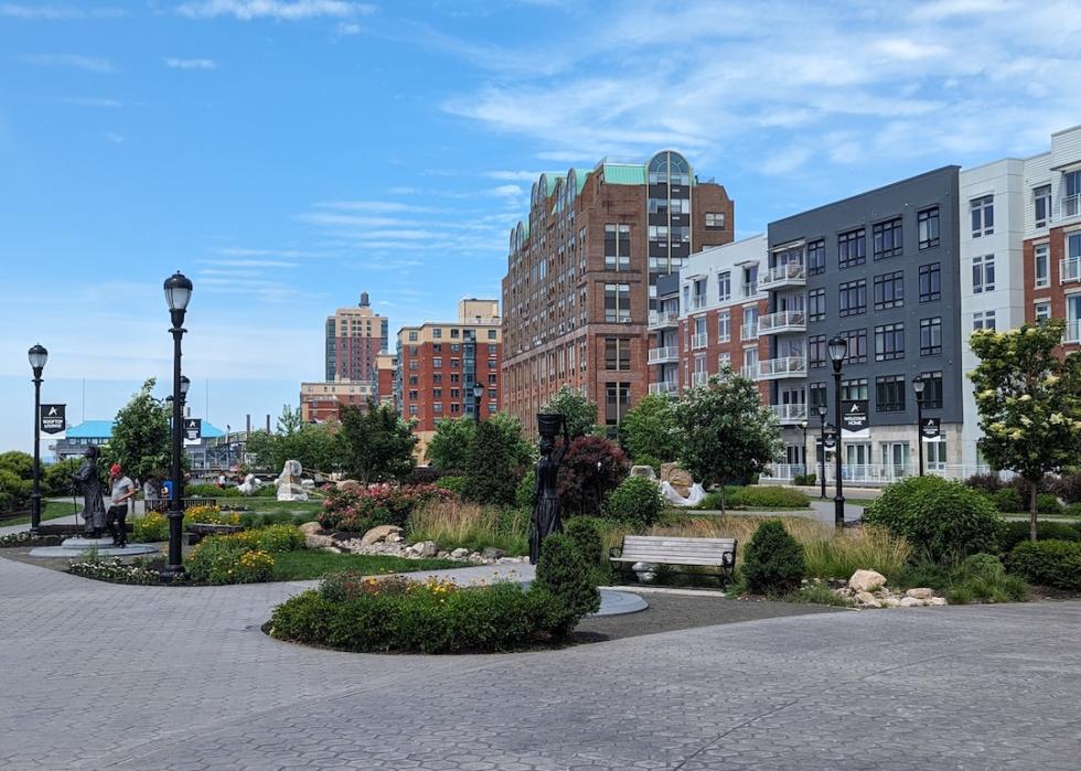 View of the Apex Hudson apartment complex and the Enslaved Africans Rain Garden.
