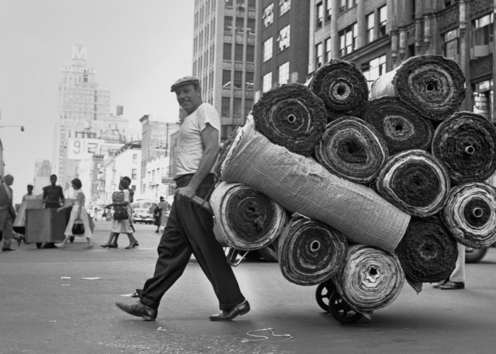 Deliveryman crossing Eighth Avenue
