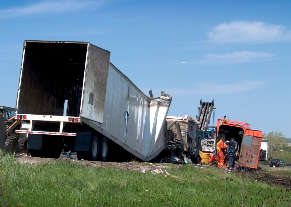 Emergency workers at the scene of a crashed semi truck