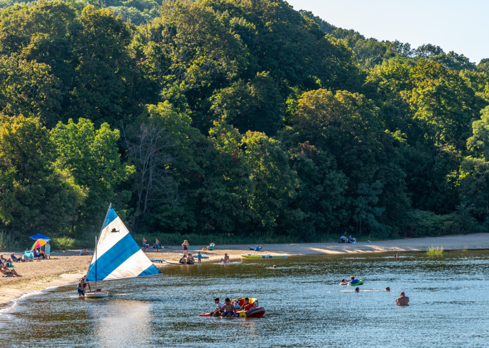 Bathers and boaters in the afternoon sun.