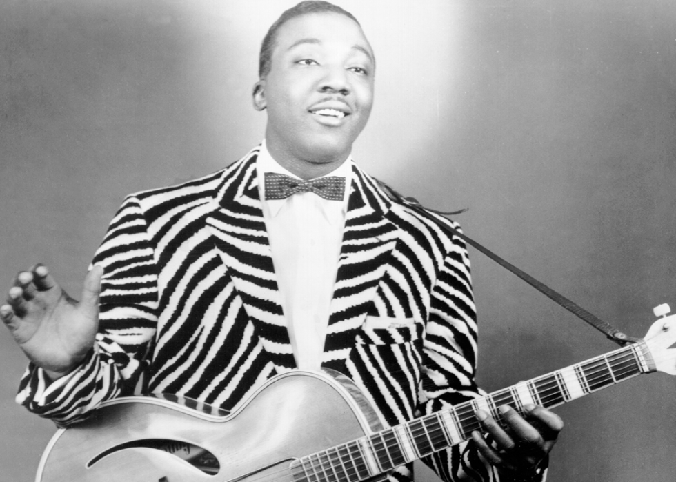 J.B. Lenoir poses with guitar.