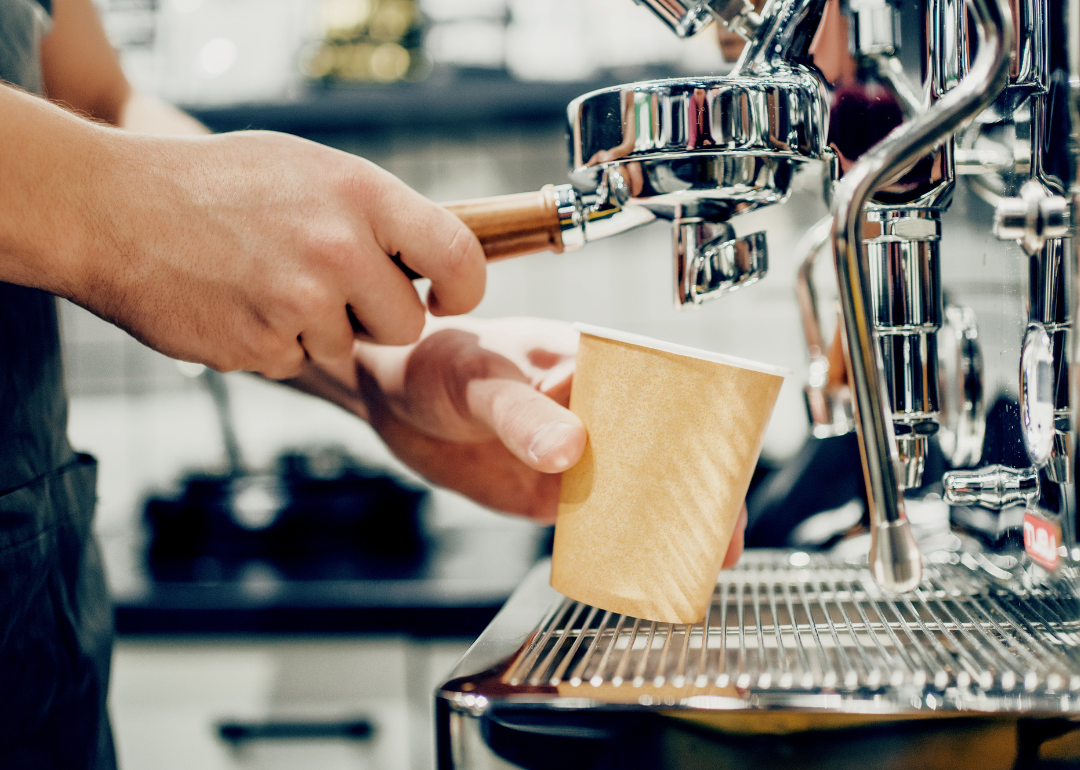 Barista preparing beverage.