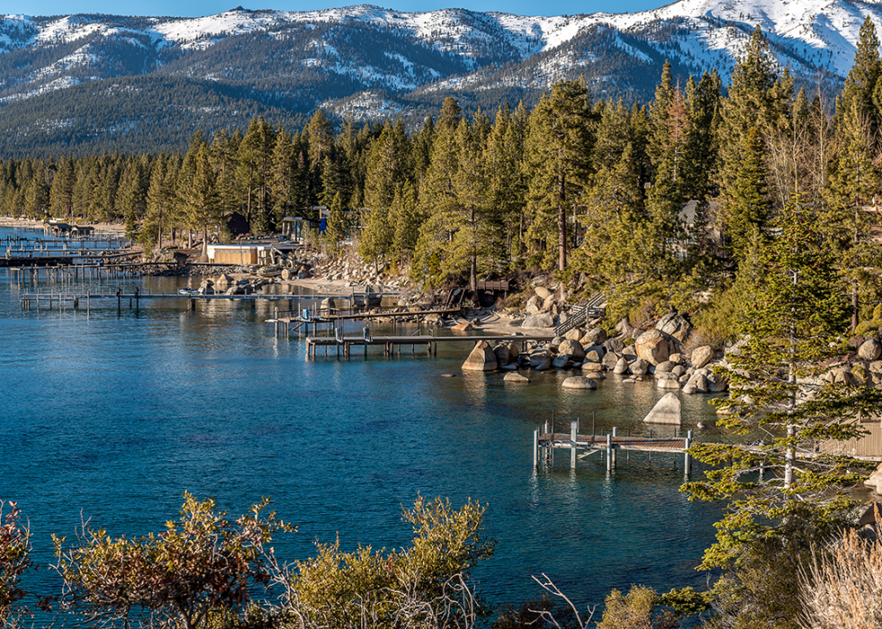 Elevated view of waterfront docks on scenic lakes.