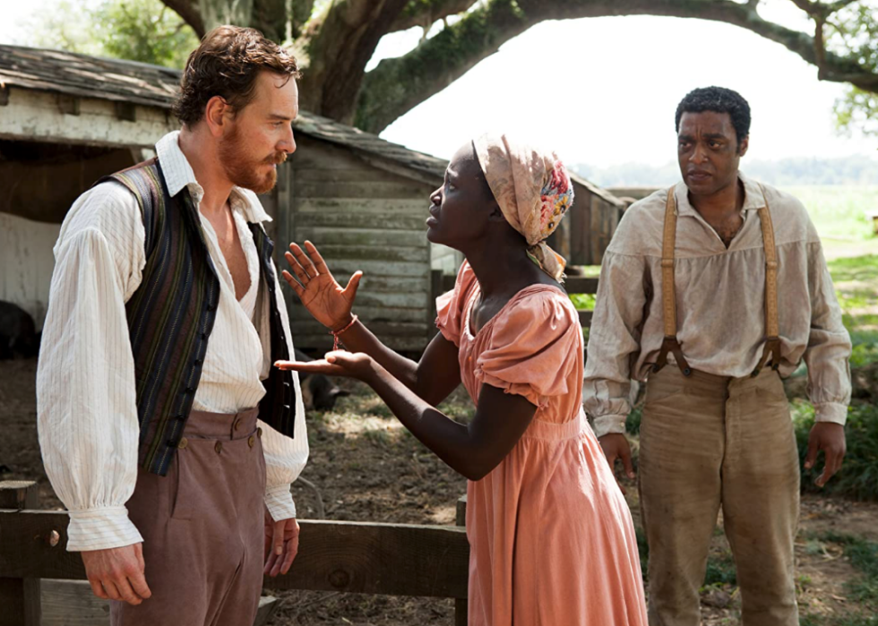 Chiwetel Ejiofor, Michael Fassbender, and Lupita Nyong'o in a scene from ’12 Years a Slave’.
