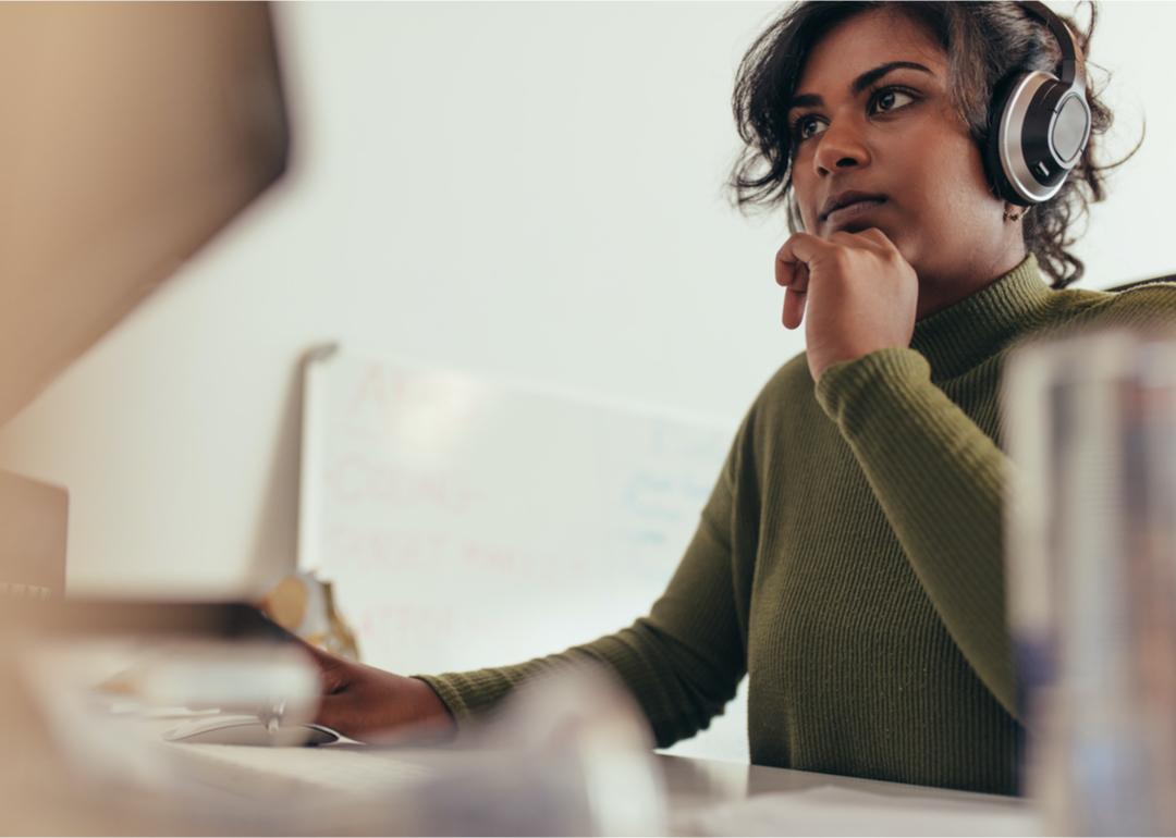 Computer programmer working at desk.