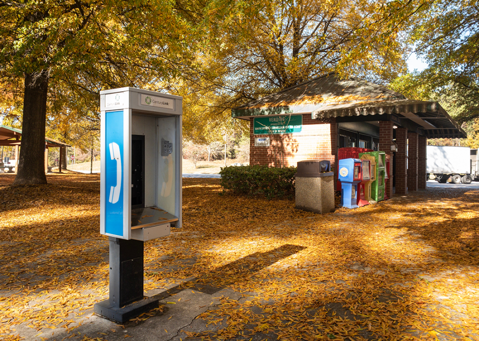 Old payphone stand at rest area.