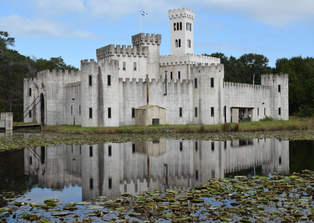 Large castle with moat and drawbridge.