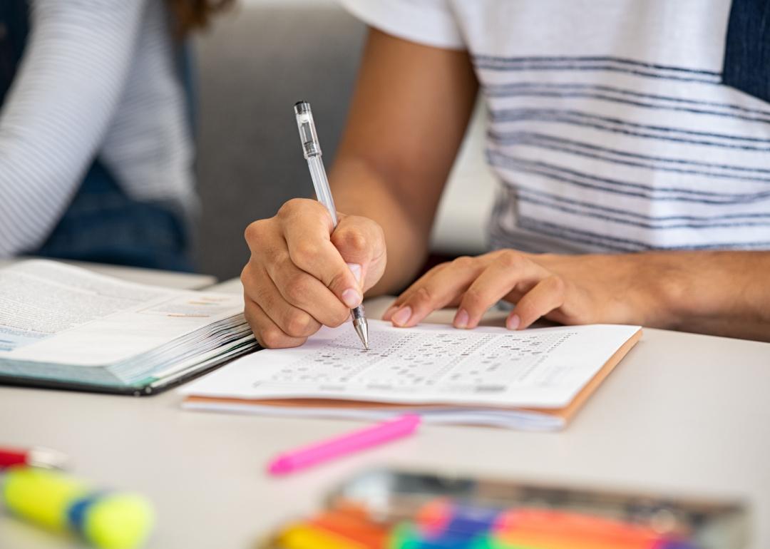 Student taking standardized test at desk.