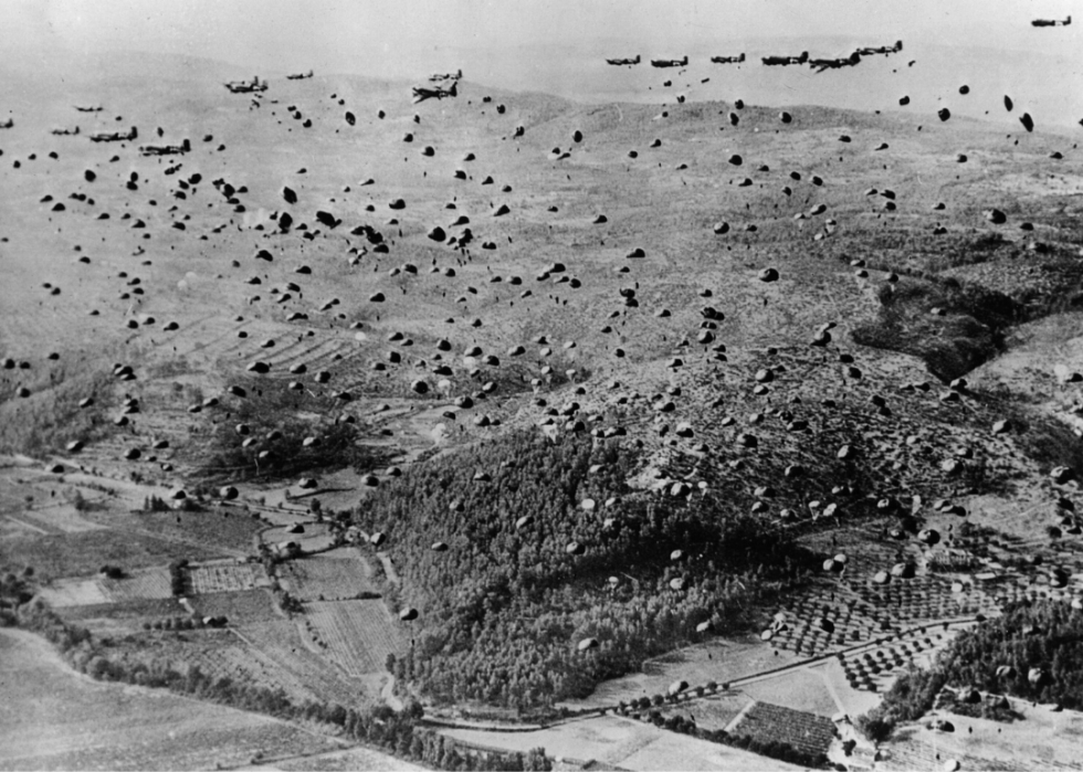 Allied soldier parachutes and supplies fill the sky over the beachhead between Marseilles and Nice during the Allied Invasion of France in August 1944.