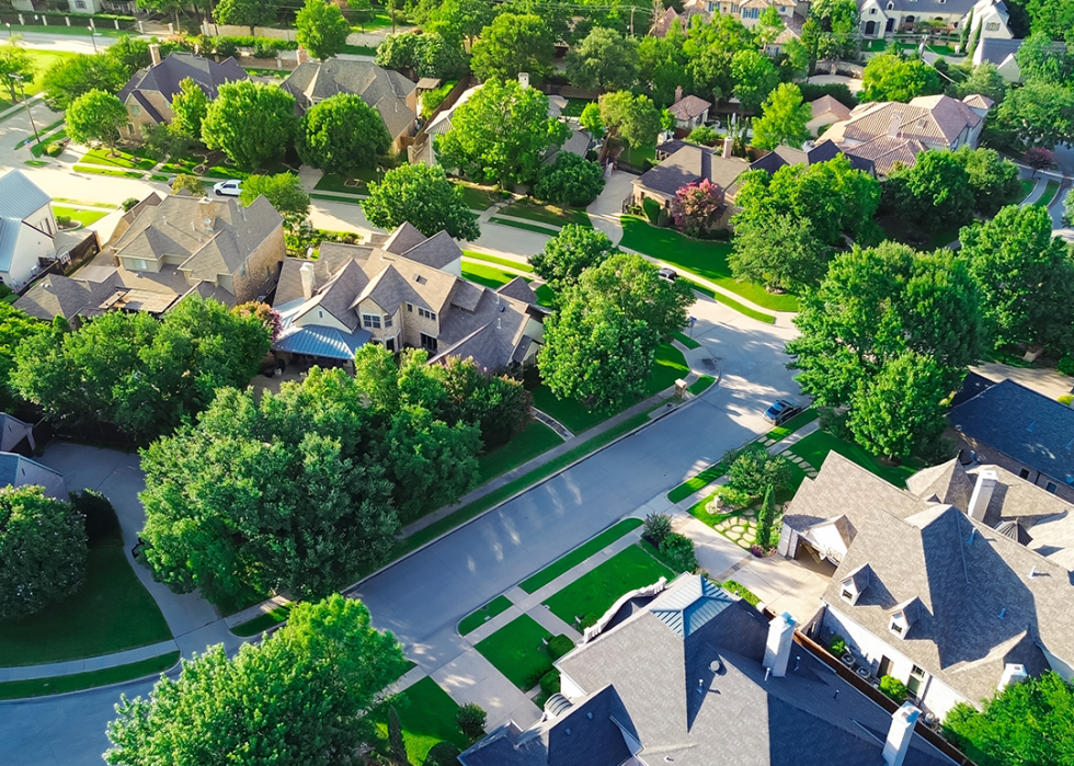 Aerial upscale suburban single family homes.