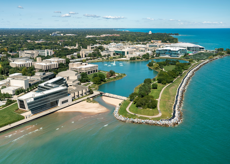 Aerial view of Northwestern University and Lake Michigan with foreground beach and walking path.