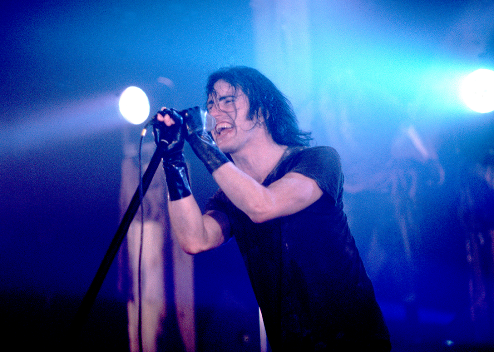 Trent Reznor performs onstage.