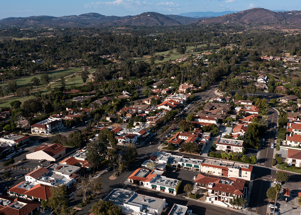 Aerial view of mission revival style architecture in Rancho Santa Fe and surrounding area.
