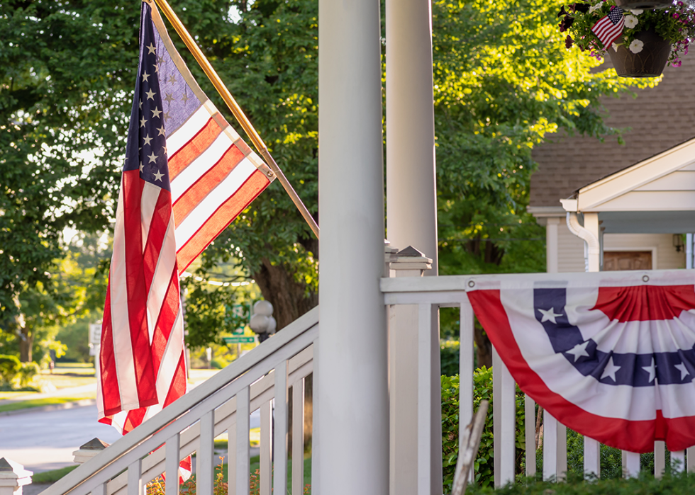American flag waving outside home on main street in downtown Barrington.