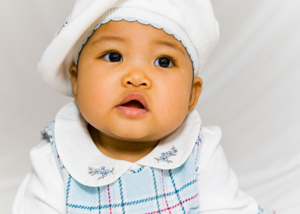 Asian girl in a white beret.