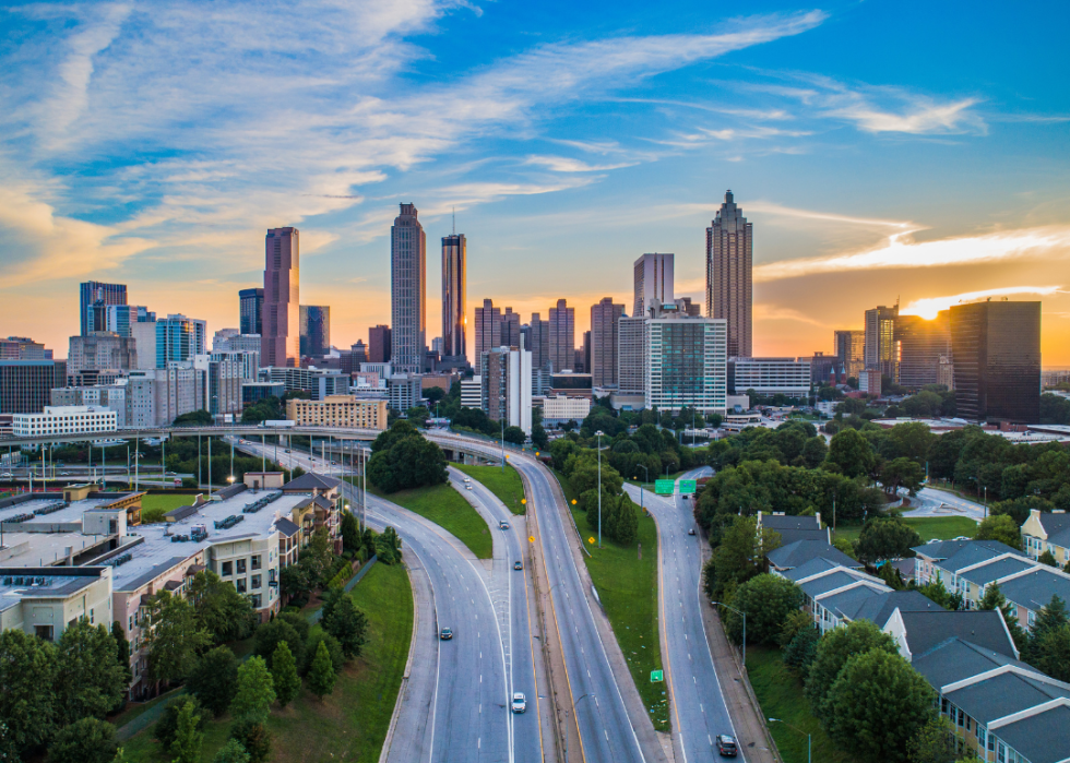 City skyline with roads leading to the city in the foreground.