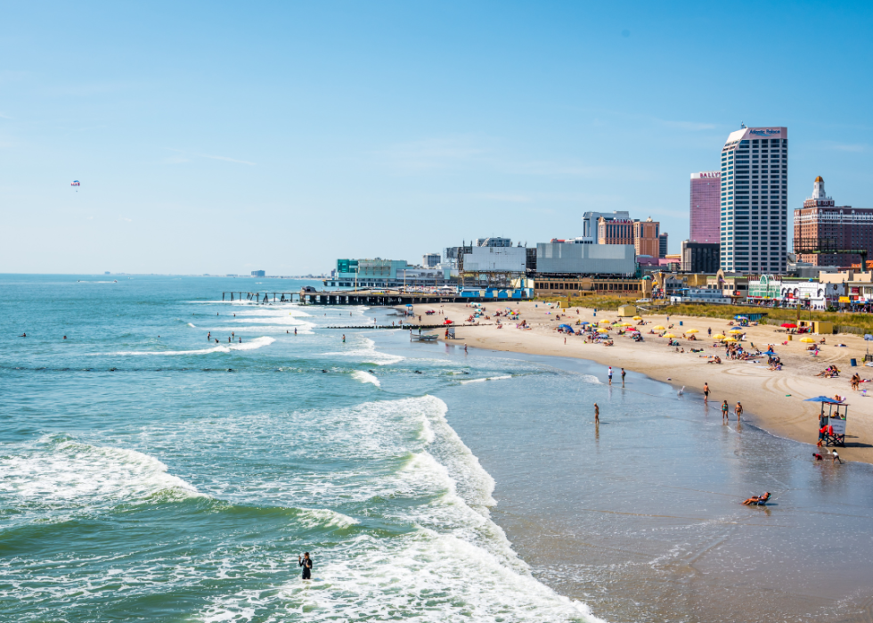 A city beach with tall buildings.
