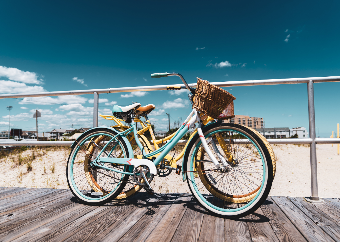 Pastel bicycles on the boardwalk on the beach.