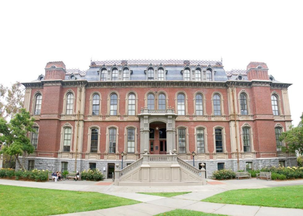A large, red brick building with many windows.