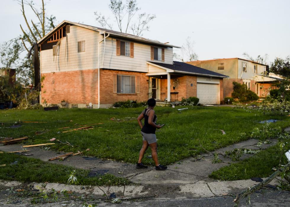 A resident inspects the damage to their home following powerful tornados on May 28, 2019, in Trotwood, Ohio.