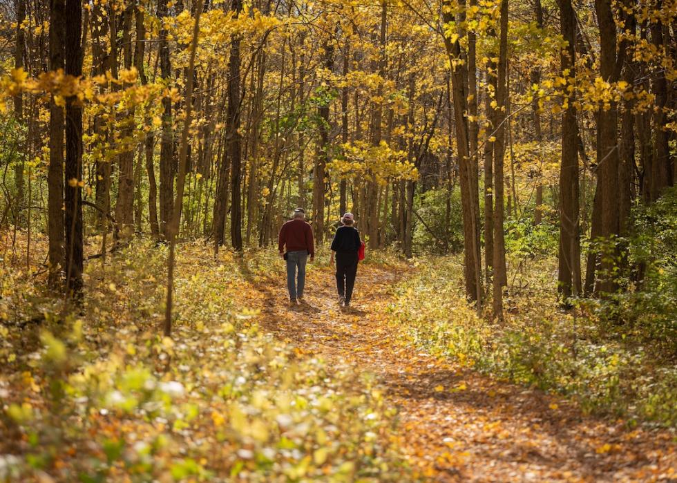 A couple walks along a path at Sugarcreek Metro Park,