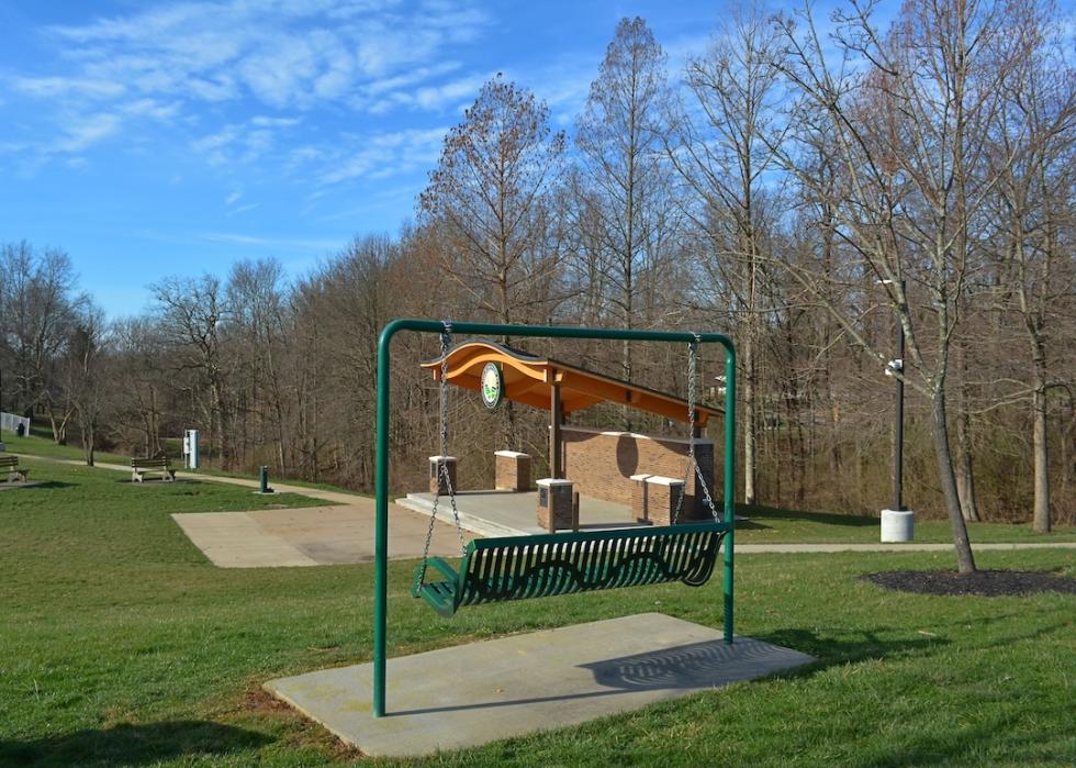 Park with bench swing and stage in Edgewood.