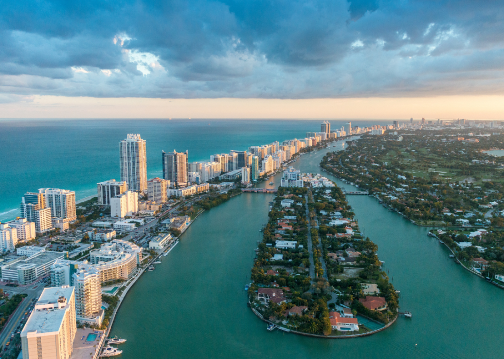 Tall buildings on narrow strips of land surrounded by water.