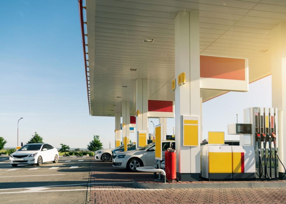 A large ornage and yellow gas station.
