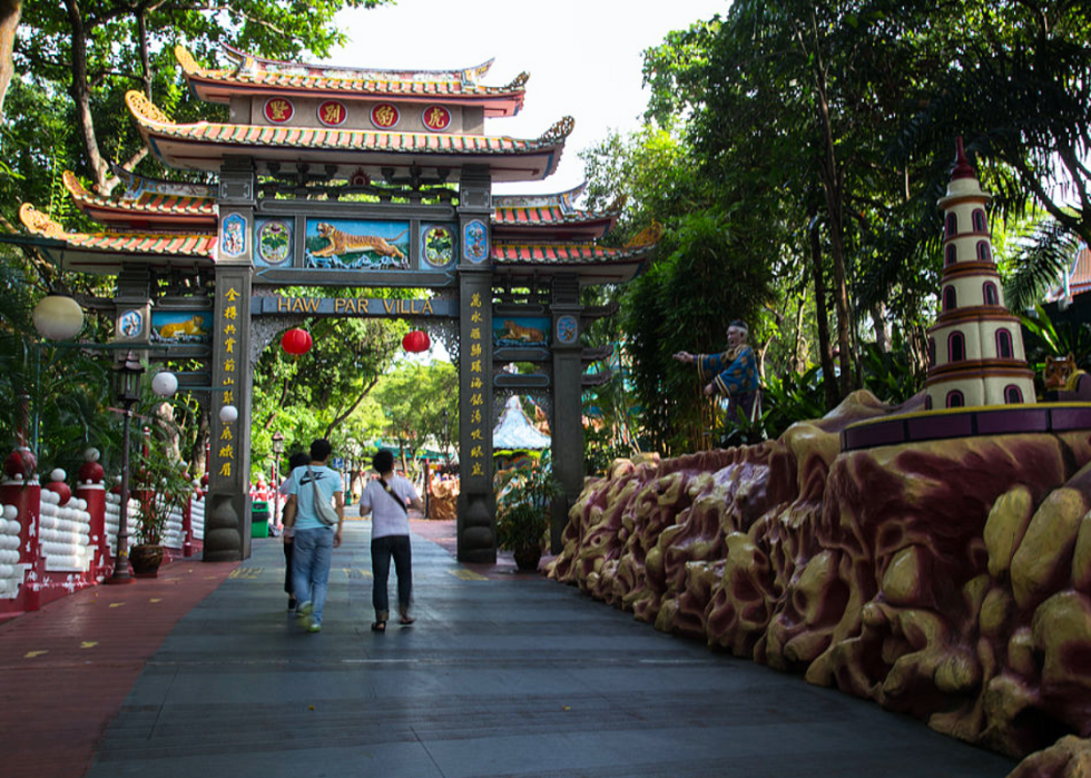 Tourists pass through the gates of Haw Par Villa.