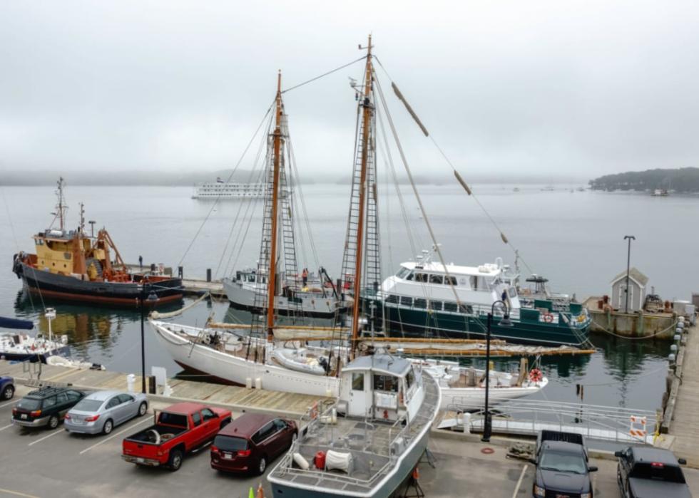 Waterfront with a portside view of a tall ship. 