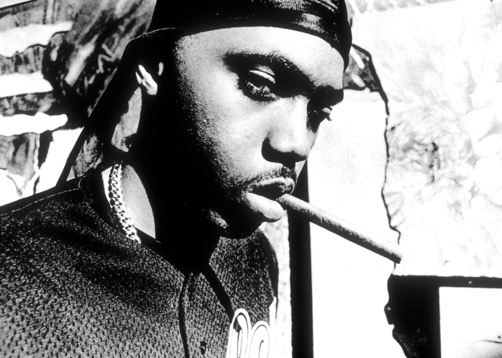 Nas with a cigar in his mouth.