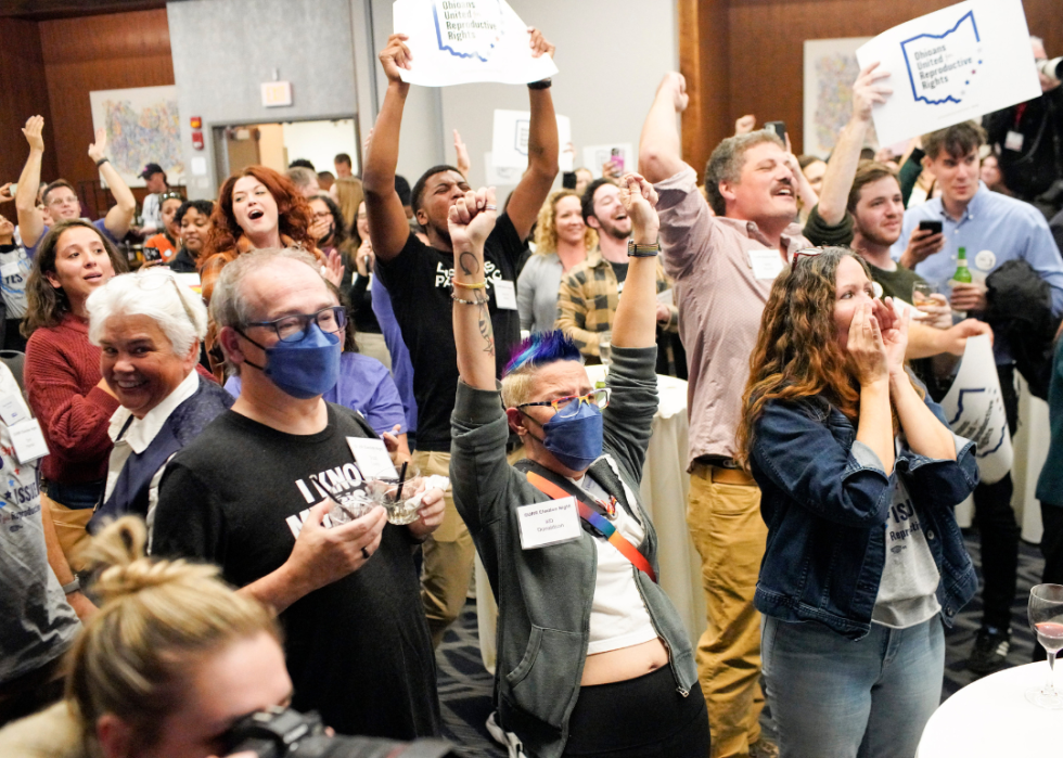 Abortion rights supporters gather to cheer the results at an election watch party in Ohio.