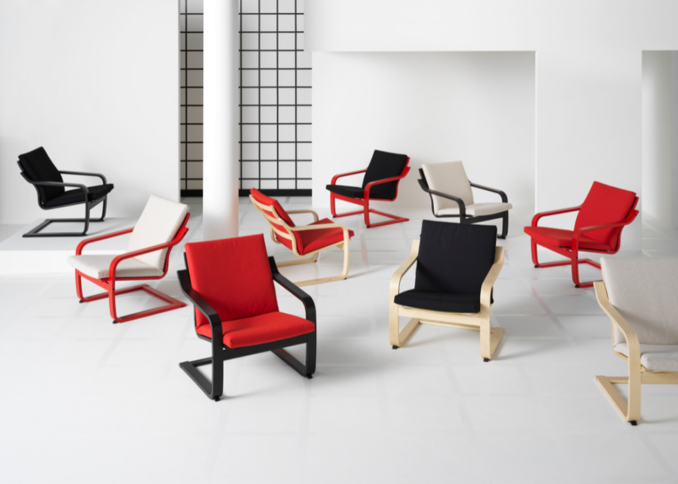 Nine of Ikea's newest Poang chairs arranged randomly in a white room.