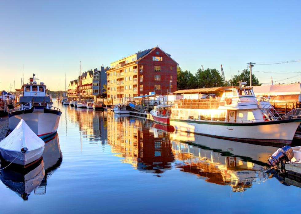 Buildings along the river in a sunset.