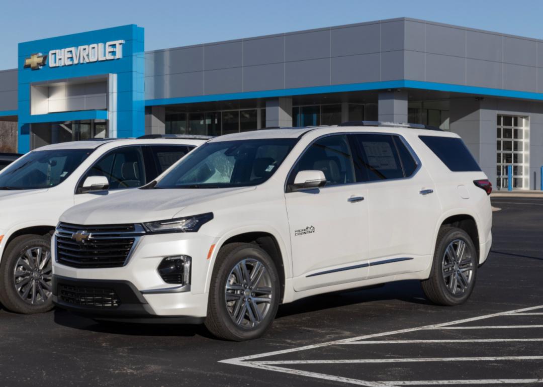 A white Chevrolet Traverse on display at a dealership.