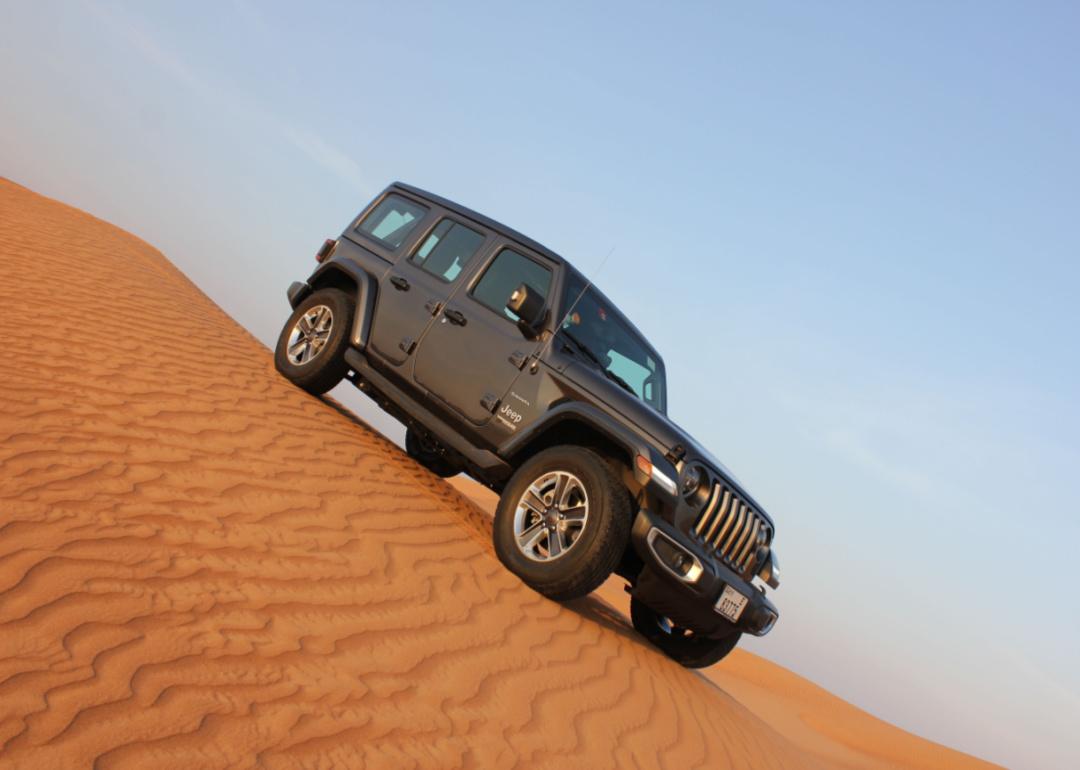 A gray Jeep Wrangler in the desert.
